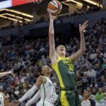 
              Seattle Storm forward Breanna Stewart (30) shoots while defended by Minnesota Lynx forward Aerial Powers (3) during the first quarter of a WNBA basketball game Friday, Aug. 12, 2022, in Minneapolis. (Elizabeth Florese/Star Tribune via AP)
            