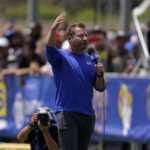
              Los Angeles Rams head coach Sean McVay speaks to fans prior to an NFL football practice Saturday, July 30, 2022, in Irvine, Calif. (AP Photo/Mark J. Terrill)
            