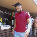 
              San Diego Padres' Fernando Tatis Jr. leaves a press conference with the media about his 80 game suspension from baseball after testing positive for Clostebol, a performance-enhancing substance in violation of Major League Baseball's Joint Drug Prevention and Treatment Program, Tuesday, Aug. 23, 2022, in San Diego. (AP Photo/Derrick Tuskan)
            