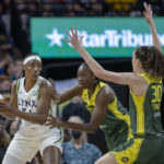 
              Minnesota Lynx center Sylvia Fowles (34) is guarded by Seattle Storm's Tina Charles, center, and Breanna Stewart (30) during the first quarter of a WNBA basketball game Friday, Aug. 12, 2022, in Minneapolis. (Elizabeth Flores/Star Tribune via AP)
            