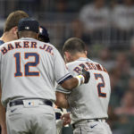 
              Houston Astros manager Dusty Baker Jr. and training staff check on Alex Bregman after being hit by pitch in the ninth inning of a baseball game against the Atlanta Braves Saturday, Aug. 20, 2022, in Atlanta. (AP Photo/Hakim Wright Sr.)
            