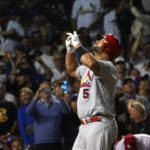 
              St. Louis Cardinals' Albert Pujols celebrates his 693rd career home run off Chicago Cubs starting pitcher Drew Smyly during the seventh inning of a baseball game Monday, Aug. 22, 2022, in Chicago. (AP Photo/Charles Rex Arbogast)
            