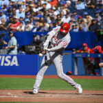 
              Los Angeles Angels designated hitter Shohei Ohtani (17) hits a two-run home run during the seventh inning of a baseball game against the Toronto Blue Jays, in Toronto, Sunday, Aug. 28, 2022. (Christopher Katsarov/The Canadian Press via AP)
            