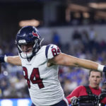 
              Houston Texans tight end Teagan Quitoriano (84) celebrates after scoring a touchdown during the second half of a preseason NFL football game against the Los Angeles Rams Friday, Aug. 19, 2022, in Inglewood, Calif. (AP Photo/Ashley Landis)
            