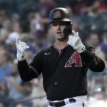 
              Arizona Diamondbacks' Christian Walker reacts after hitting an RBI-single against the Colorado Rockies in the first inning during a baseball game, Saturday, Aug. 6, 2022, in Phoenix. (AP Photo/Rick Scuteri)
            