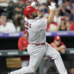 
              St. Louis Cardinals' Albert Pujols watches his solo home run off Colorado Rockies relief pitcher Austin Gomber during the sixth inning of a baseball game Wednesday, Aug. 10, 2022, in Denver. (AP Photo/David Zalubowski)
            
