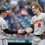 
              Baltimore Orioles' Gunnar Henderson (2) celebrates with Austin Hays after hitting a solo home run off of Cleveland Guardians starting pitcher Triston McKenzie for his first hit in his Major lLague debut during the fourth inning of a baseball game Wednesday, Aug. 31, 2022, in Cleveland. (AP Photo/Ron Schwane)
            