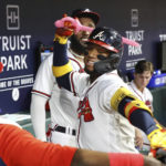 
              Atlanta Braves designated hitter Ronald Acuna swings the pink sword in the dugout celebrating his solo home run during the fifth inning of a baseball game against the Colorado Rockies Wednesday, Aug. 31, 2022, in Atlanta. (Curtis Compton/Atlanta Journal-Constitution via AP)
            