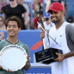 
              Nick Kyrgios, right, of Australia, poses with the winners trophy after he defeated Yoshihito Nishioka, left, of Japan, during a final at the Citi Open tennis tournament Sunday, Aug. 7, 2022, in Washington. Kyrgios won 6-4, 6-3. (AP Photo/Nick Wass)
            