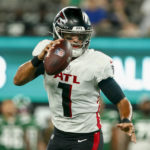 
              Atlanta Falcons quarterback Marcus Mariota (1) looks to pass on the run during the first half of an NFL football game against the New York Jets, Monday, Aug. 22, 2022, in East Rutherford, N.J. (AP Photo/John Munson)
            