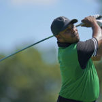 
              Harold Varner III watches his shot on the 17th tee during the first round of the BMW Championship golf tournament at Wilmington Country Club, Thursday, Aug. 18, 2022, in Wilmington, Del. (AP Photo/Julio Cortez)
            