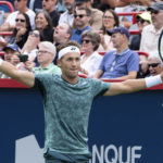 
              Casper Ruud of Norway reacts during his match against Canada's Felix Auger-Aliassime during quarterfinal play at the National Bank Open tennis tournament, Friday, Aug. 12, 2022 in Montreal. (Paul Chiasson/The Canadian Press via AP)
            