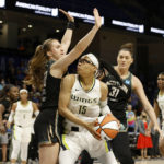 
              New York Liberty guard Sabrina Ionescu, front left, and center Stefanie Dolson (31) defend against Dallas Wings guard Allisha Gray (15) during the first half of a WNBA basketball game in Arlington, Texas, Monday, Aug. 8, 2022. (Michael Ainsworth/The Dallas Morning News via AP)
            