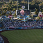 
              A screen at Dodger Stadium shows late broadcaster Vin Scully during a tribute to him before a baseball game between the Los Angeles Dodgers and the San Diego Padres on Friday, Aug. 5, 2022, in Los Angeles. (AP Photo/Jae C. Hong)
            