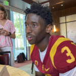 
              FILE - Southern California receiver Jordan Addison speaks with reporters on the school's campus in Los Angeles on Thursday, Aug. 4, 2022. Addison won the Biletnikoff Award as the nation's top receiver last season at Pittsburgh before his high-profile transfer to the Trojans. (AP Photo/Greg Beacham, File)
            