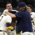 
              Milwaukee Brewers' Victor Caratini (7) is congratulated by teammates after hitting a two-run single during the 11th inning of the team's baseball game against the Los Angeles Dodgers on Tuesday, Aug. 16, 2022, in Milwaukee. The Brewers won 5-4. (AP Photo/Aaron Gash)
            