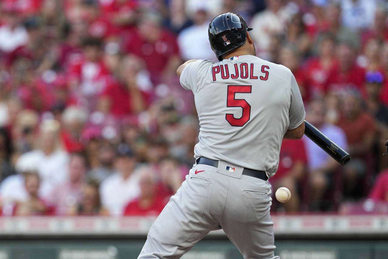 St. Louis Cardinals' Albert Pujols is hit by a pitch during the second inning of the team's basebal...