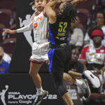 
              Connecticut Sun guard Natisha Hiedeman (2) fouls Dallas Wings guard Tyasha Harris (52) during Game 1 of a WNBA basketball first-round playoff series Thursday, Aug. 18, 2022, in Uncasville, Conn. (Sean D. Elliot/The Day via AP)
            