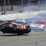 
              Chase Briscoe (14) lifts and spins in the air along the front stretch after coming out of turn 4 during a NASCAR Cup Series auto race at Daytona International Speedway, Sunday, Aug. 28, 2022, in Daytona Beach, Fla. (AP Photo/Phelan M. Ebenhack)
            