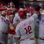 
              Philadelphia Phillies' Kyle Schwarber (12) is greeted in the dugout by teammates after hitting a three run home run against the Arizona Diamondbacks during the fourth inning of a baseball game, Monday, Aug. 29, 2022, in Phoenix. (AP Photo/Matt York)
            