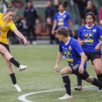 
              Portland Thorns midfielder Olivia Moultrie, left, of Team Yellow, takes a shot on goal during a coed charity match with Thorns and Portland Timbers players at Providence Park in Portland, Ore., Wednesday, April 27, 2022. It's been a little more than a year since Olivia Moultrie signed with the Portland Thorns after suing to join the National Women's Soccer League at just 15 years old. For Moultrie, the lasting lesson of her legal odyssey is that women should have the same opportunities to reach the top tier of U.S. pro soccer as men. Even if they're still teenagers.(Sean Meagher/The Oregonian via AP)
            