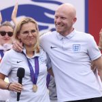 
              England head coach Sarina Wiegman, left, and Arjan Veurink on stage  at an event at Trafalgar Square in London, Monday, Aug. 1, 2022. England beat Germany 2-1 and won the final of the Women's Euro 2022 on Sunday.  (James Manning/PA via AP)
            
