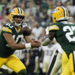 
              Green Bay Packers quarterback Jordan Love (10) pitches out to running back Patrick Taylor (27) during the first half of a preseason NFL football game against the New Orleans Saints Friday, Aug. 19, 2022, in Green Bay, Wis. (AP Photo/Morry Gash)
            