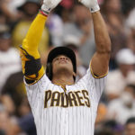 
              San Diego Padres' Juan Soto reacts after hitting a triple during the sixth inning of a baseball game against the Colorado Rockies, Thursday, Aug. 4, 2022, in San Diego. (AP Photo/Gregory Bull)
            