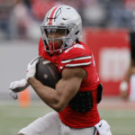 
              FILE - Ohio State running back TreVeyon Henderson plays in an NCAA college spring football game Saturday, April 16, 2022, in Columbus, Ohio. Henderson was selected to The Associated Press preseason All-America team, Monday, Aug. 22, 2022. (AP Photo/Jay LaPrete, File)
            