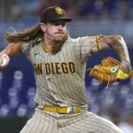 
              San Diego Padres starting pitcher Mike Clevinger aims a pitch during the first inning of a baseball game against the Miami Marlins, Wednesday, Aug. 17, 2022, in Miami. (AP Photo/Marta Lavandier)
            