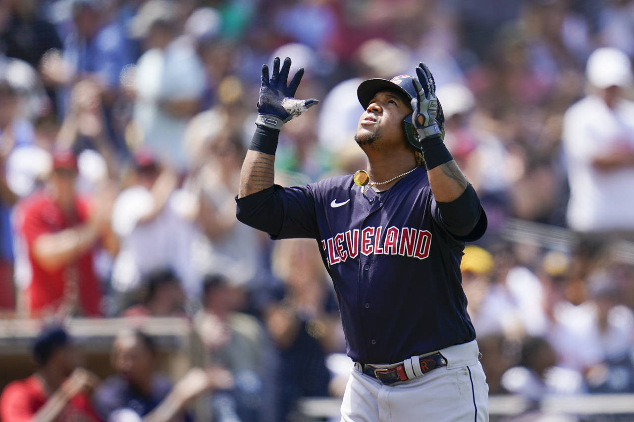Cleveland Guardians' Jose Ramirez reacts after hitting a home run during the fourth inning of a bas...