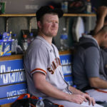 
              San Francisco Giants pitcher Logan Webb sits in the dugout after being pulled against the Detroit Tigers in the fifth inning of a baseball game in Detroit, Wednesday, Aug. 24, 2022. (AP Photo/Paul Sancya)
            