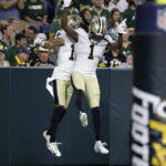 
              New Orleans Saints wide receiver Chris Olave celebrates his touchdown reception with wide receiver Marquez Callaway (1) during the first half of a preseason NFL football game against the Green Bay Packers Friday, Aug. 19, 2022, in Green Bay, Wis. (AP Photo/Mike Roemer)
            