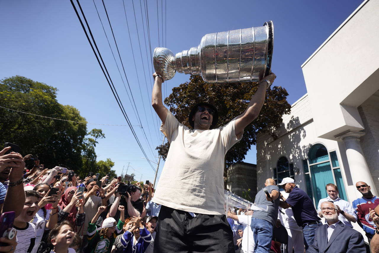 NHL player Nazem Kadri hoist the Stanley Cup in front of the London Muslim Mosque in London, Ontari...