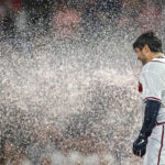 
              Atlanta Braves Travis d'Arnaud is doused after a walk off single in the eleventh inning of a baseball game against the Houston Astros Saturday, Aug. 20, 2022, in Atlanta. (AP Photo/Hakim Wright Sr.)
            