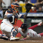 
              Boston Red Sox's Tommy Pham, right, scores as Houston Astros catcher Martin Maldonado handles the throw at home plate during the fourth inning of a baseball game Tuesday, Aug. 2, 2022, in Houston. (AP Photo/David J. Phillip)
            