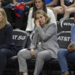 
              Minnesota Lynx coach Cheryl Reeve wipes away a tear on the bench during the fourth quarter of the team's WNBA basketball game against the Seattle Storm on Friday, Aug. 12, 2022, in Minneapolis. (Elizabeth Flores/Star Tribune via AP)
            