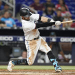 
              Miami Marlins' Jon Berti hits a solo home run against the Tampa Bay Rays during the sixth inning of a baseball game Wednesday, Aug. 31, 2022, in Miami. (AP Photo/Lynne Sladky)
            