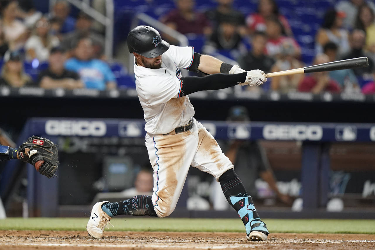 Miami Marlins' Jon Berti hits a solo home run against the Tampa Bay Rays during the sixth inning of...