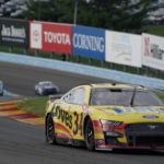 
              Michael McDowell makes his way through the Esses during a NASCAR Cup Series auto race in Watkins Glen, N.Y., Sunday, Aug. 21, 2022. (AP Photo/Seth Wenig)
            