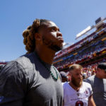 
              Washington Commanders defensive end Chase Young makes his way to the locker room during the first half of a NFL Preseason football game between the Carolina Panthers and the Washington Commanders on Saturday, Aug. 13, 2022 at FedExField in Landover, Md. (Shaban Athuman/Richmond Times-Dispatch via AP)
            