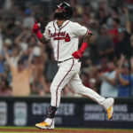 
              Atlanta Braves' Orlando Arcia gestures as he runs the bases after hitting a two-run home run in the fifth inning of a baseball game against the Philadelphia Phillies Tuesday, Aug. 2, 2022, in Atlanta. (AP Photo/John Bazemore)
            