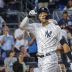 
              New York Yankees' Aaron Judge celebrates a home run in the third inning of a baseball game against the New York Mets, Monday, Aug. 22, 2022, in New York. (AP Photo/Corey Sipkin)
            