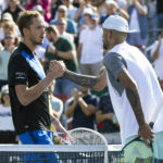 
              Daniil Medvedev of Russia, left, congratulates Nick Kyrgios of Australia for his victory during second round play at the National Bank Open tennis tournament Wednesday Aug. 10, 2022. in Montreal. (Paul Chiasson/The Canadian Press via AP)
            