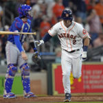 
              Houston Astros' Alex Bregman (2) tosses his bat after hitting a two-run home run against the Texas Rangers during the fifth inning of a baseball game Thursday, Aug. 11, 2022, in Houston. (AP Photo/David J. Phillip)
            