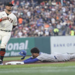 
              Los Angeles Dodgers' Miguel Vargas, right, steals third base next to San Francisco Giants third baseman J.D. Davis during the second inning of a baseball game in San Francisco, Wednesday, Aug. 3, 2022. (AP Photo/Jeff Chiu)
            