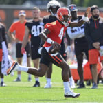 
              Cleveland Browns quarterback Deshaun Watson runs during an NFL football practice in Berea, Ohio, Sunday, Aug. 7, 2022. (AP Photo/David Dermer)
            