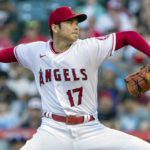 
              Los Angeles Angels starting pitcher Shohei Ohtani throws to a Texas Rangers batter during the first inning of a baseball game in Anaheim, Calif., Thursday, July 28, 2022. (AP Photo/Alex Gallardo)
            