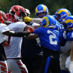 
              A third scuffle escalates into a brawl during a joint preseason NFL football camp practice between the Cincinnati Bengals and the Los Angeles Rams in Cincinnati, Thursday, Aug. 25, 2022. Practice was ended early after the third scuffle turned into a broader fight between players on both teams. (Sam Greene/The Cincinnati Enquirer via AP)
            