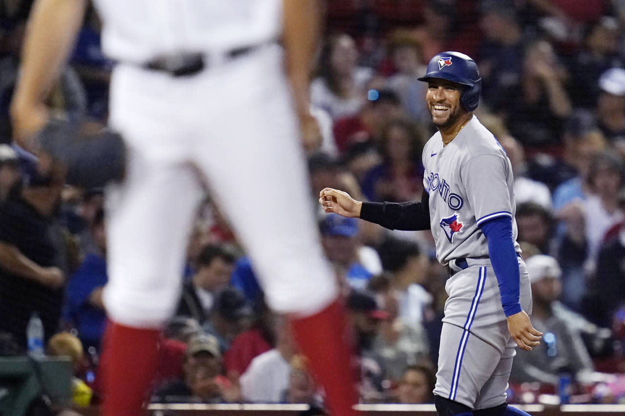 Toronto Blue Jays George Springer smiles after his three RBI triple off Boston Red Sox starting pit...